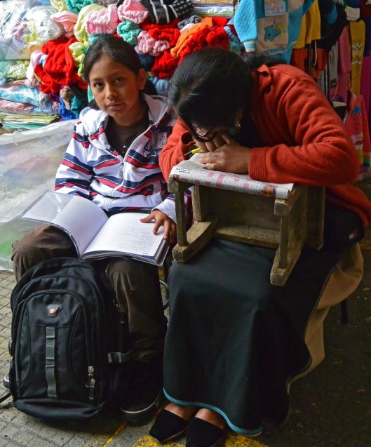 Keeping up with their studies, Cuenca market